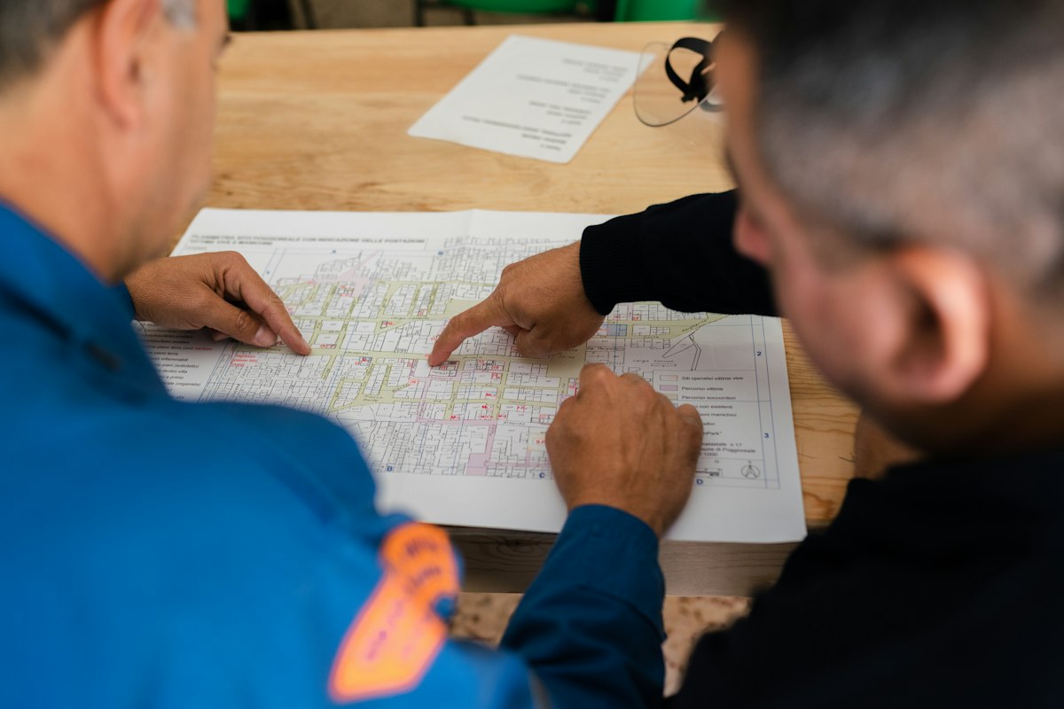 Two coordinators reviewing a site plan together
